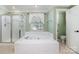 Bright main bathroom featuring a soaking tub, a glass shower, and a separate toilet room at 1002 Hollyhedge Ln, Indian Trail, NC 28079
