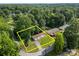 Aerial view of the home and property surrounded by lush trees at 1011 Rachel Ln, Salisbury, NC 28147