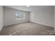 Cozy bedroom with neutral carpet, bright natural light, and a closet at 1011 Rachel Ln, Salisbury, NC 28147