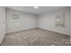 Bedroom with neutral carpet, filled with bright natural light, and a spacious closet at 1011 Rachel Ln, Salisbury, NC 28147