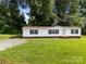 Charming single-story home with a well-maintained lawn and mature trees at 1011 Rachel Ln, Salisbury, NC 28147