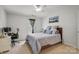 This bedroom features a computer desk, ceiling fan and natural light through the window at 1012 Laparc Ln, Indian Trail, NC 28079
