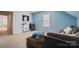 Bonus room featuring a comfortable couch, TV, and storage creating a flexible space for entertainment at 1012 Laparc Ln, Indian Trail, NC 28079