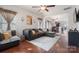 Spacious living room with hardwood floors and a view into the dining area and kitchen at 1012 Laparc Ln, Indian Trail, NC 28079
