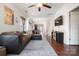 Bright living room featuring hardwood floors and a view of the dining area and stairs at 1012 Laparc Ln, Indian Trail, NC 28079
