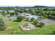 Aerial view of the community playground, tennis courts, and pool at 1012 Laparc Ln, Indian Trail, NC 28079
