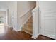 Inviting entryway features hardwood floors and a carpeted staircase leading to the upper level at 1012 Laparc Ln, Indian Trail, NC 28079