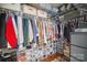 Organized walk-in closet with clothing racks, shelving, and storage containers for shoes and accessories at 1012 Laparc Ln, Indian Trail, NC 28079