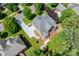 Aerial view of a home with well-manicured landscaping, a firepit, and a deck at 10321 Lemington Dr, Mint Hill, NC 28227