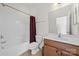 Bathroom featuring bath/shower combo, wood vanity, toilet and tile flooring at 10321 Lemington Dr, Mint Hill, NC 28227