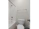 Bathroom featuring a shower/tub combo and toilet with white fixtures and chrome hardware at 10321 Lemington Dr, Mint Hill, NC 28227