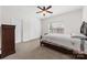 Bedroom featuring neutral carpet, ceiling fan, closet and a window view at 10321 Lemington Dr, Mint Hill, NC 28227