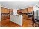 Bright kitchen featuring granite countertops, a kitchen island and stainless steel appliances at 10321 Lemington Dr, Mint Hill, NC 28227