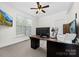 Bright office with neutral walls and carpet, plus a large desk and natural light for productivity at 10321 Lemington Dr, Mint Hill, NC 28227
