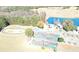 Expansive aerial view of the grounds featuring mini golf, parking, a recreation lake, and more at 109 Pine St, New London, NC 28127