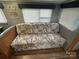 Comfortable living room with built-in seating and a cushioned sofa in a compact design at 109 Pine St, New London, NC 28127