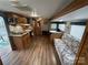 Comfortable RV living room with dinette, fireplace, and kitchenette with modern appliances at 109 Pine St, New London, NC 28127