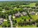 Aerial view of a beautiful home with a well-manicured lawn and surrounded by lush greenery and mature trees at 126 Northbridge Dr, Mooresville, NC 28115