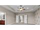 Spacious bedroom with trey ceilings, fan, and attached bathroom at 126 Northbridge Dr, Mooresville, NC 28115