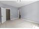Spacious bedroom with neutral carpet, light blue walls, and ample natural light at 126 Northbridge Dr, Mooresville, NC 28115