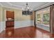 Dining room with a decorative chandelier, molding and large window at 126 Northbridge Dr, Mooresville, NC 28115