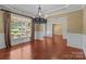 Dining room with a decorative chandelier, molding and large window at 126 Northbridge Dr, Mooresville, NC 28115
