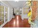 Elegant entryway with hardwood floors, white trim, and a decorative wreath accent at 126 Northbridge Dr, Mooresville, NC 28115