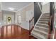 Spacious foyer with hardwood floors, staircase, and decorative glass front door and sidelights at 126 Northbridge Dr, Mooresville, NC 28115