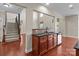 Open kitchen layout featuring wood cabinets and stainless-steel appliances, and hardwood floors at 126 Northbridge Dr, Mooresville, NC 28115