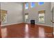 Open-concept living room features high ceilings, fireplace, and large windows at 126 Northbridge Dr, Mooresville, NC 28115