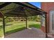 Relaxing outdoor gazebo with brick flooring, offering a perfect spot for leisure and entertaining in the backyard at 126 Northbridge Dr, Mooresville, NC 28115