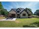 Spacious backyard featuring patio with fire pit and outdoor seating, perfect for entertaining at 140 Robin Rd, Lincolnton, NC 28092