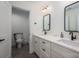 Bathroom with double sink vanity, modern matte black faucets and hardware, and neutral tile floor at 140 Robin Rd, Lincolnton, NC 28092