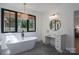 Beautiful bathroom featuring a freestanding tub, a vanity area, and bright natural light at 140 Robin Rd, Lincolnton, NC 28092