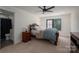 Comfortable bedroom featuring soft lighting, warm carpet, and stylish furnishings for a relaxing retreat at 140 Robin Rd, Lincolnton, NC 28092