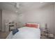 Bedroom with a fluffy white bed, vanity, and decorative pillows under a ceiling fan at 140 Robin Rd, Lincolnton, NC 28092