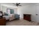 Cozy bedroom with neutral tones, a ceiling fan, carpet and a window to bring in natural light at 140 Robin Rd, Lincolnton, NC 28092