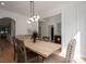 Dining room with a modern light fixture, a wooden dining table, and stylish decor creating a cozy ambiance at 140 Robin Rd, Lincolnton, NC 28092