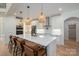 Bright kitchen featuring a large island with seating, pendant lighting, stainless steel appliances, and modern cabinetry at 140 Robin Rd, Lincolnton, NC 28092