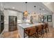 Bright kitchen with a large island, barstool seating, pendant lights, and stainless steel appliances at 140 Robin Rd, Lincolnton, NC 28092