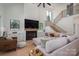 Bright living room showcasing a fireplace, modern staircase, and a comfortable seating area at 140 Robin Rd, Lincolnton, NC 28092