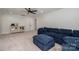 Living room features a plush blue sectional sofa, neutral decor, and a mirrored vanity at 140 Robin Rd, Lincolnton, NC 28092