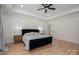 The main bedroom features hardwood floors, a black headboard, and stylish lighting at 140 Robin Rd, Lincolnton, NC 28092