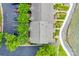Birds-eye view of a condo complex with landscaping, parking, and lake access showcasing the property's layout at 14053 Queens Harbor Rd, Charlotte, NC 28278