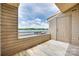 Private condo balcony offers stunning water views, creating a serene outdoor space for residents to unwind and enjoy at 14053 Queens Harbor Rd, Charlotte, NC 28278
