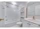 Well-lit bathroom featuring a tub-shower combo, white vanity, and ample storage space for a clean, modern feel at 14053 Queens Harbor Rd, Charlotte, NC 28278