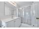 Bright bathroom featuring a shower with sliding glass doors and white vanity at 14053 Queens Harbor Rd, Charlotte, NC 28278