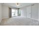 Bedroom with waterfront views, sliding glass doors and neutral carpet at 14053 Queens Harbor Rd, Charlotte, NC 28278