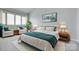 Inviting bedroom with a plush bed, cozy seating, and bright windows, creating a relaxing retreat at 14053 Queens Harbor Rd, Charlotte, NC 28278