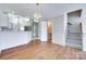 Inviting dining room featuring hardwood floors and a decorative chandelier at 14053 Queens Harbor Rd, Charlotte, NC 28278